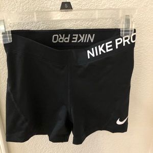 Black NIKE pros.